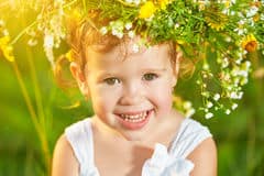 funny-happy-baby-child-girl-wreath-nature-laughing-su-meadow-summer-56535271
